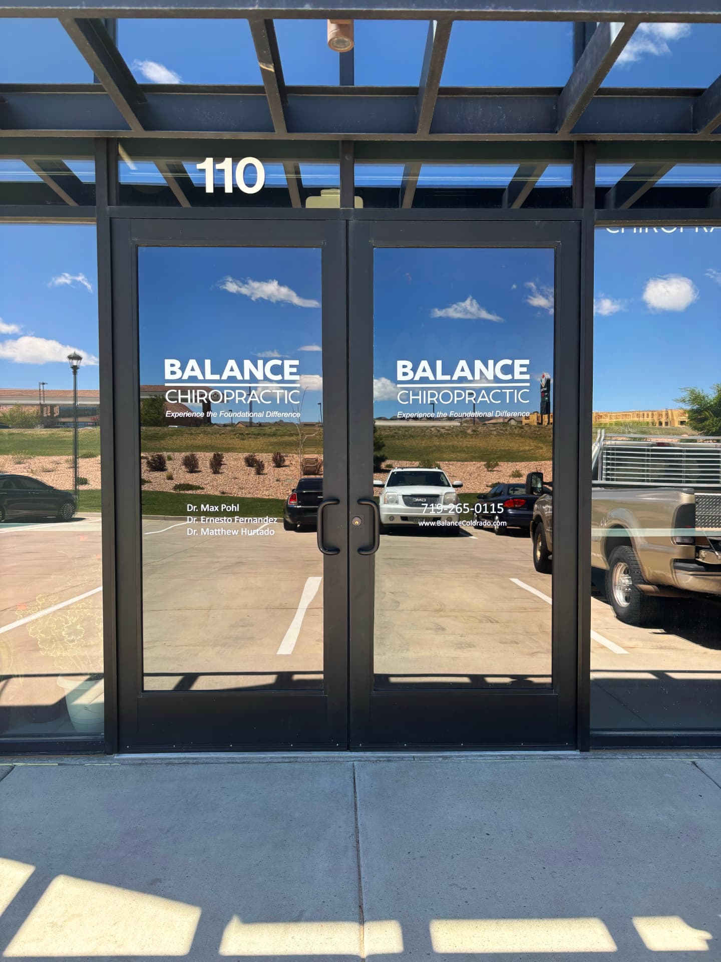 Tinted glass entry doors at a Colorado Springs chiropractic office