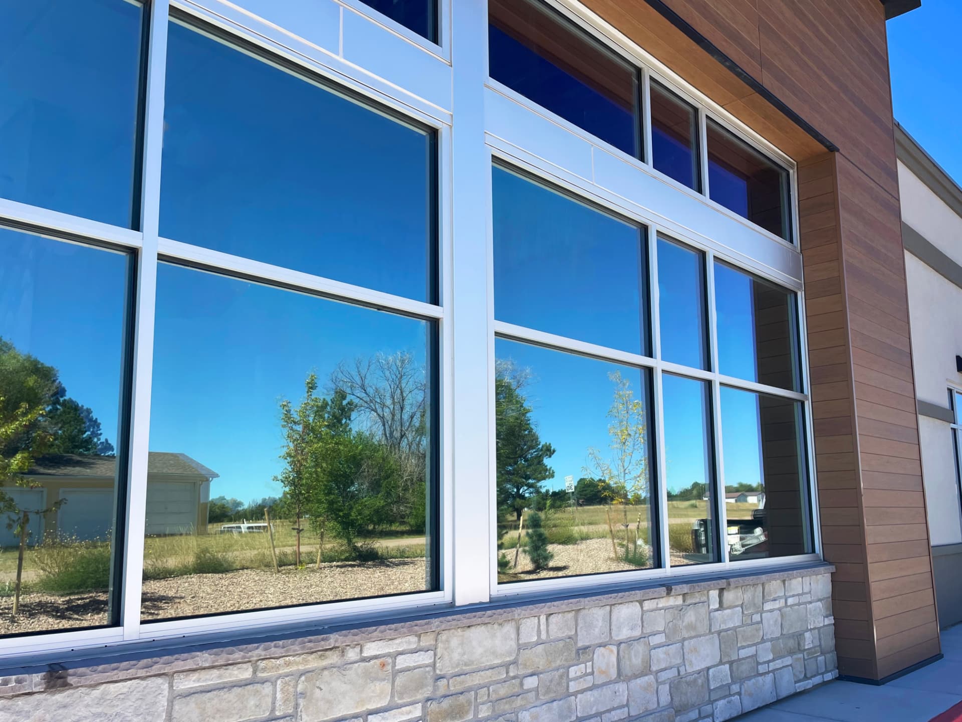 Tinted commercial windows on an office building exterior