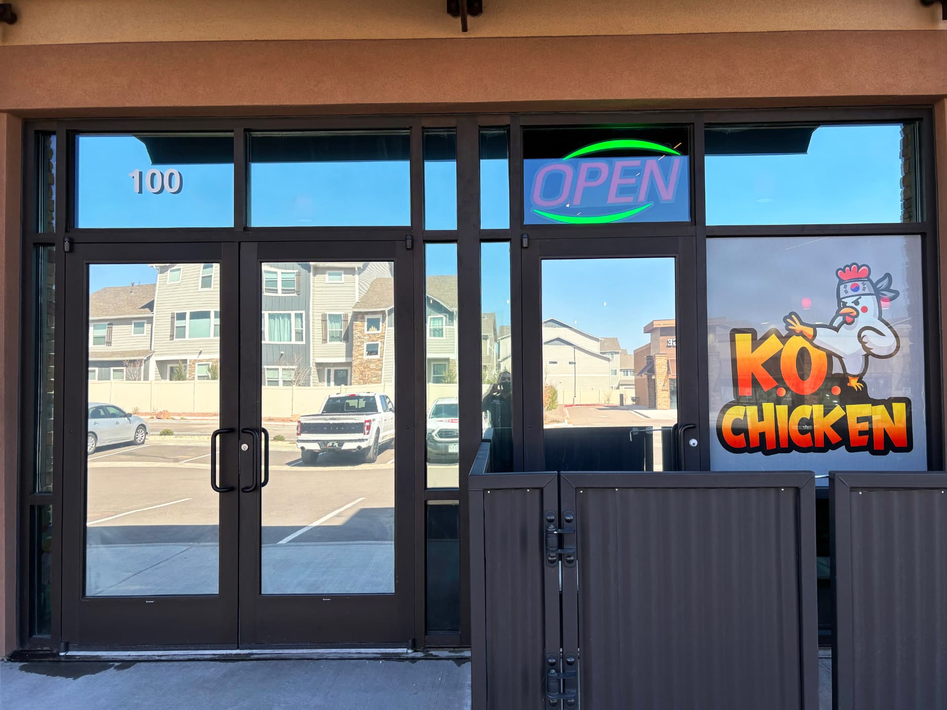 Tinted storefront entry doors and windows at a Colorado Springs restaurant